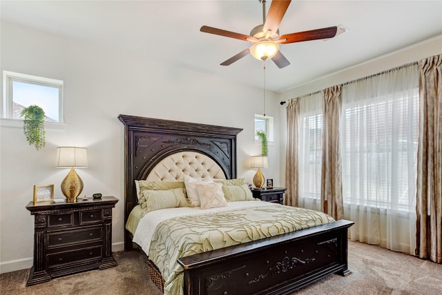 bedroom featuring baseboards, a ceiling fan, and carpet flooring