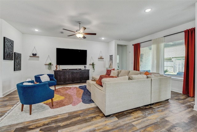 living area featuring recessed lighting, baseboards, ceiling fan, and wood finished floors