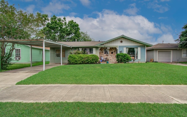 ranch-style home with a garage, a carport, a front yard, and concrete driveway