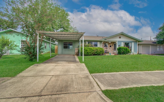 single story home with a carport, concrete driveway, and a front yard