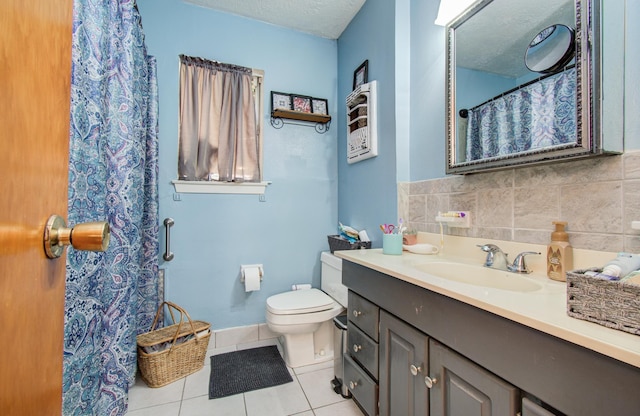 bathroom with vanity, toilet, tile patterned floors, a textured ceiling, and curtained shower