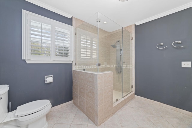 bathroom featuring tile patterned flooring, ornamental molding, a stall shower, and toilet