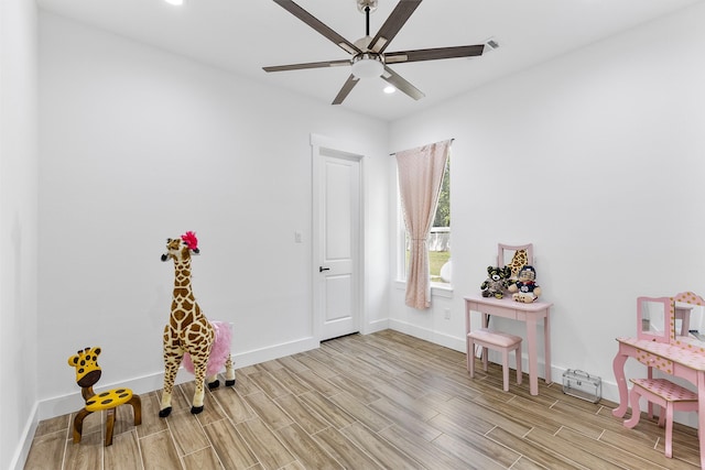 game room featuring baseboards, recessed lighting, ceiling fan, and wood finished floors
