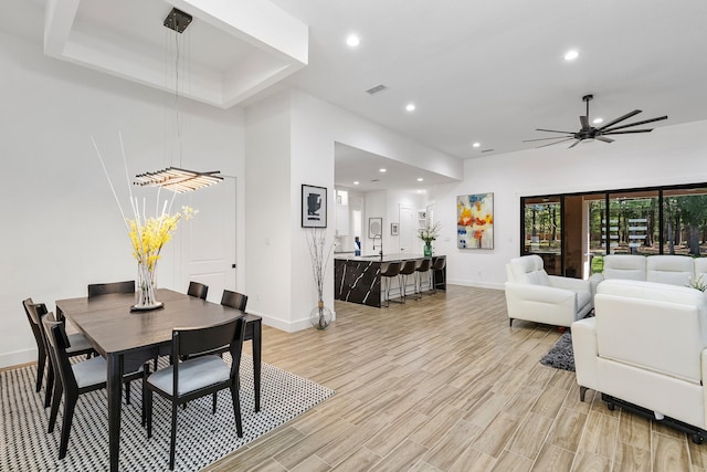 dining space with baseboards, recessed lighting, light wood-style flooring, and visible vents