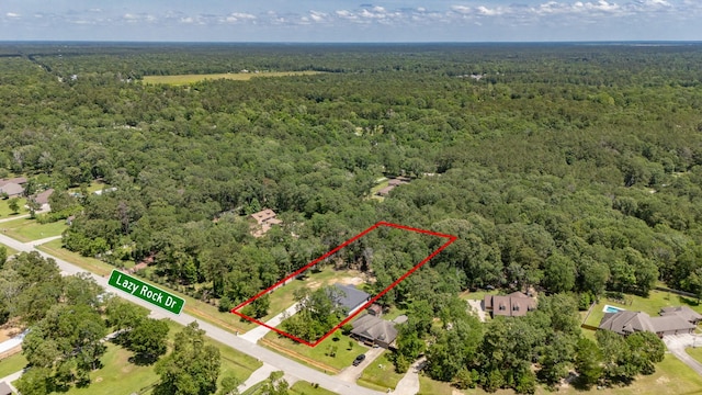 aerial view featuring a view of trees