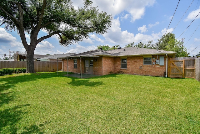 1406 Foxwood Rd, Houston, TX 77008 - rear view of property with a fenced backyard, a yard, and brick siding