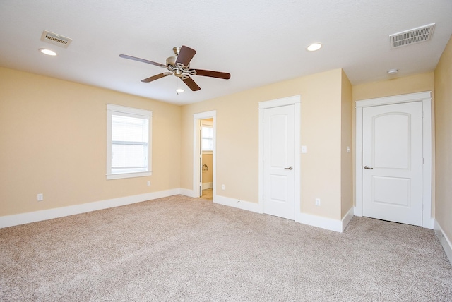 1406 Foxwood Rd, Houston, TX 77008 - unfurnished bedroom featuring visible vents, carpet flooring, and baseboards