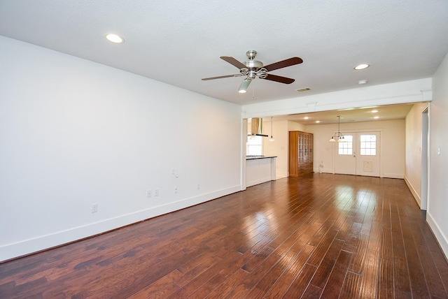 1406 Foxwood Rd, Houston, TX 77008 - unfurnished living room with ceiling fan, visible vents, baseboards, dark wood-style floors, and recessed lighting