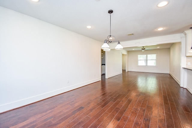 1406 Foxwood Rd, Houston, TX 77008 - empty room featuring baseboards, recessed lighting, dark wood-style flooring, and visible vents