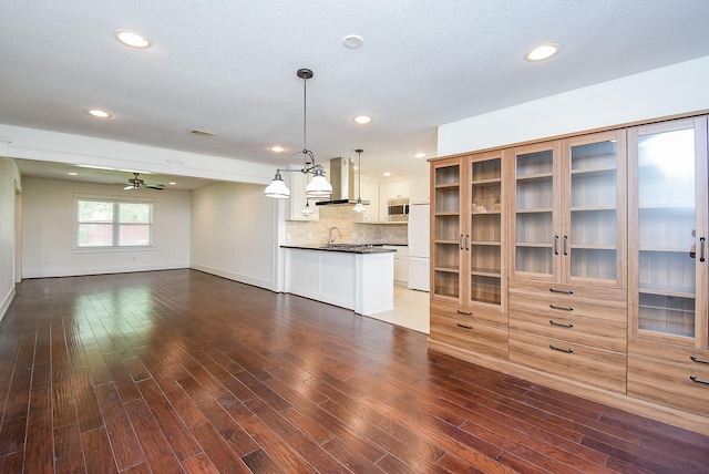 1406 Foxwood Rd, Houston, TX 77008 - unfurnished living room with visible vents, baseboards, and dark wood-style floors