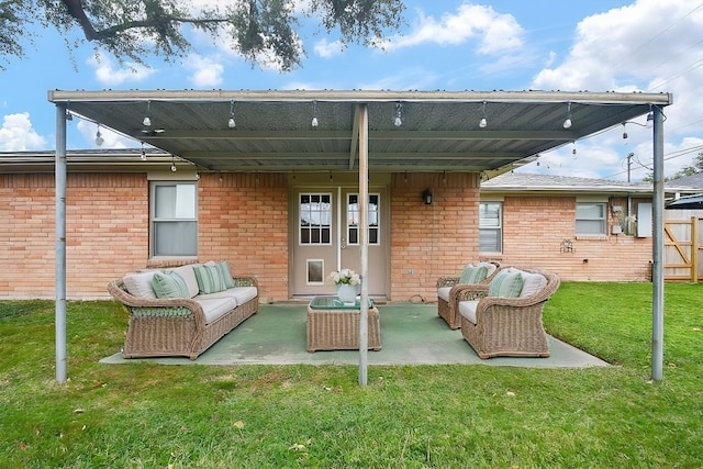 1406 Foxwood Rd, Houston, TX 77008 - rear view of house with a yard, outdoor lounge area, and brick siding