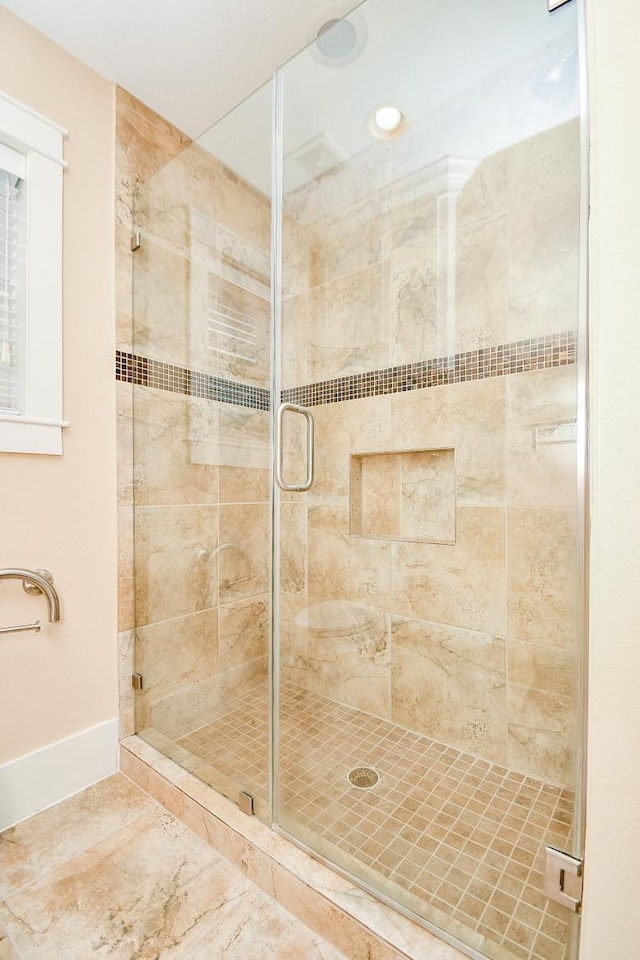 1406 Foxwood Rd, Houston, TX 77008 - bathroom featuring baseboards, a shower stall, and marble finish floor