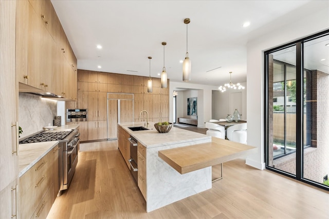 kitchen featuring a sink, appliances with stainless steel finishes, modern cabinets, and light brown cabinets