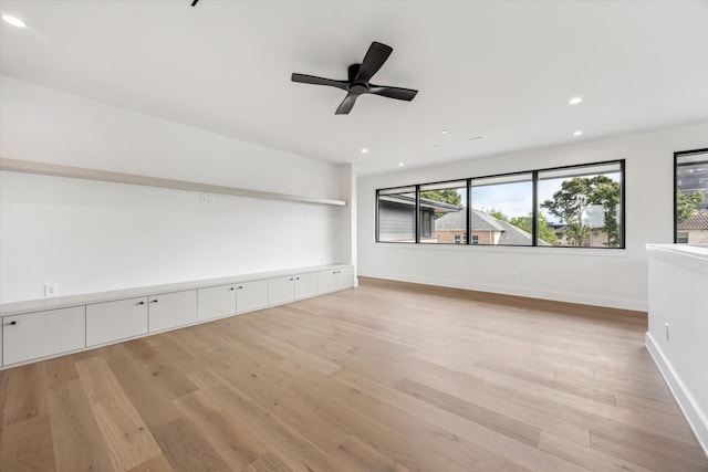 spare room featuring baseboards, ceiling fan, recessed lighting, and light wood-style flooring