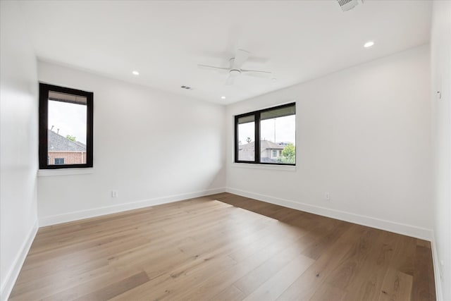 empty room with recessed lighting, baseboards, ceiling fan, and wood finished floors