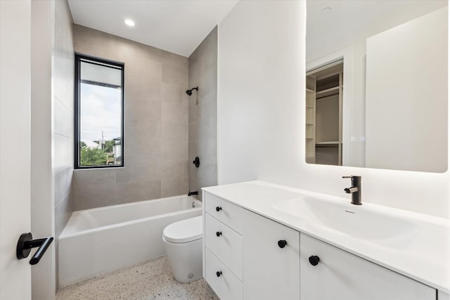 bathroom featuring vanity, toilet, speckled floor, recessed lighting, and  shower combination