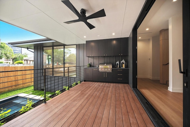 deck with ceiling fan and grilling area