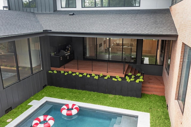 view of pool with a deck and a jacuzzi