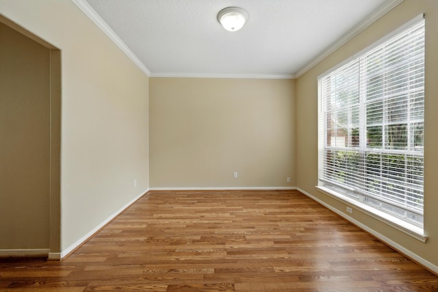 11030 Sprucedale Ct, Houston, TX 77070 - empty room with crown molding, wood finished floors, and baseboards