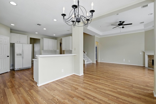 11030 Sprucedale Ct, Houston, TX 77070 - unfurnished living room featuring a chandelier, light wood finished floors, recessed lighting, ceiling fan, and stairway