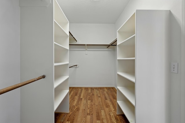 11030 Sprucedale Ct, Houston, TX 77070 - spacious closet featuring wood finished floors