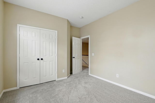 11030 Sprucedale Ct, Houston, TX 77070 - unfurnished bedroom with carpet, baseboards, and a closet