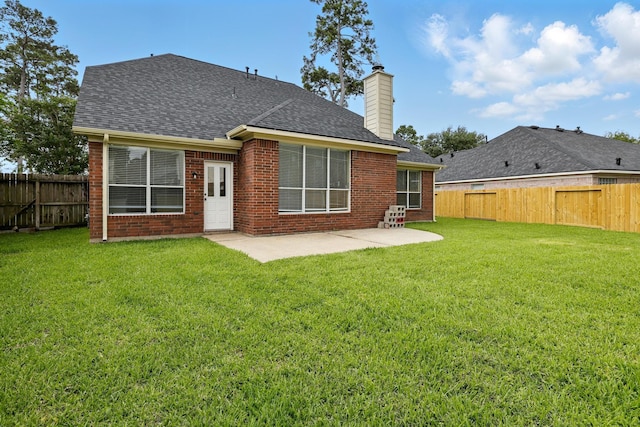 11030 Sprucedale Ct, Houston, TX 77070 - rear view of house featuring a chimney, a patio, a shingled roof, and brick siding