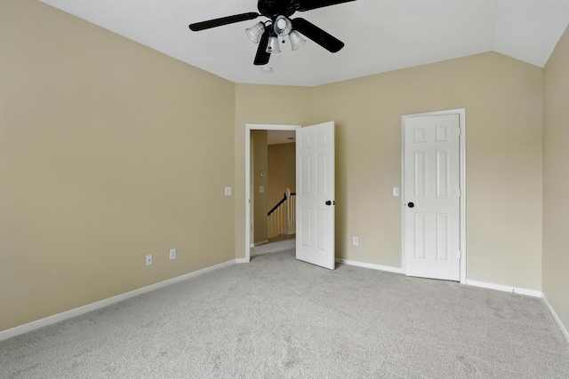 11030 Sprucedale Ct, Houston, TX 77070 - unfurnished bedroom with carpet, baseboards, ceiling fan, and lofted ceiling
