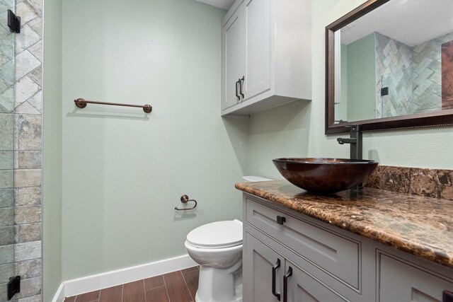 230009 Kama Dr, Porter, TX 77365 - full bath with vanity, toilet, baseboards, wood finished floors, and tiled shower