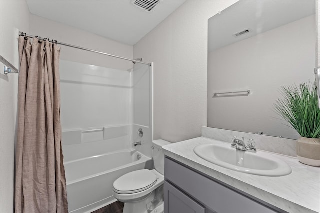 full bathroom with vanity, shower / tub combo with curtain, toilet, and visible vents
