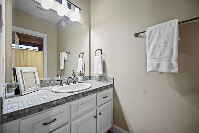 full bath with vanity and visible vents
