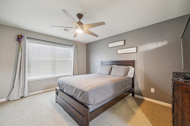bedroom featuring baseboards, ceiling fan, carpet flooring, and visible vents