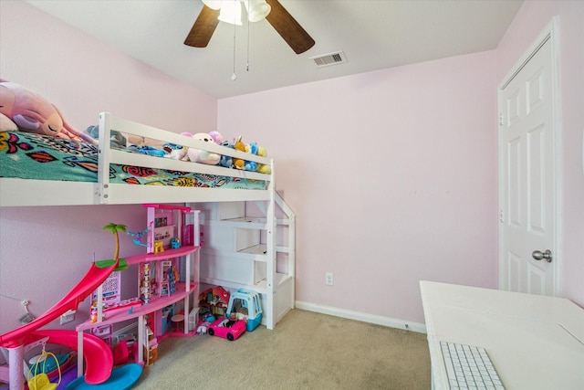 carpeted bedroom featuring a ceiling fan, baseboards, and visible vents