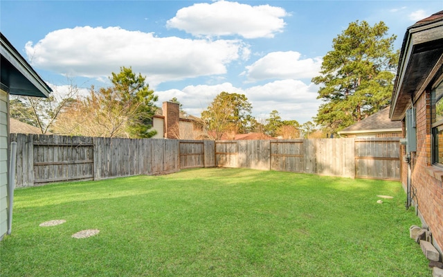 view of yard featuring a fenced backyard