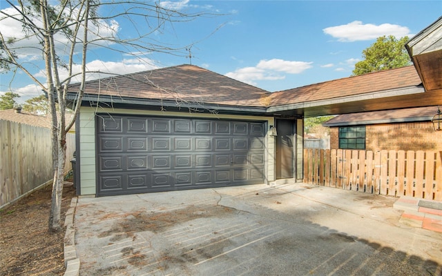 garage featuring fence