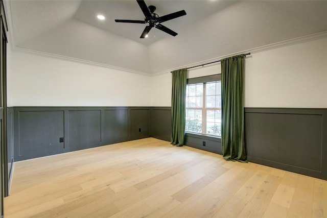 unfurnished room featuring wainscoting, a decorative wall, recessed lighting, and wood finished floors