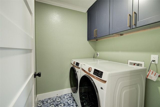 laundry room with crown molding, baseboards, cabinet space, and washing machine and clothes dryer