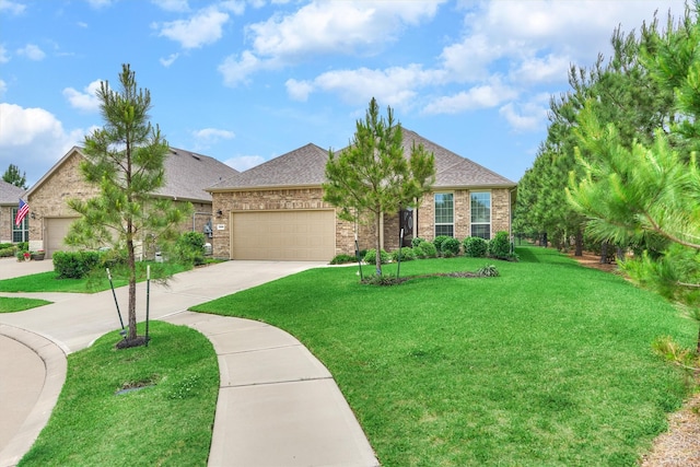 view of front facade featuring a shingled roof, an attached garage, brick siding, a front yard, and concrete driveway