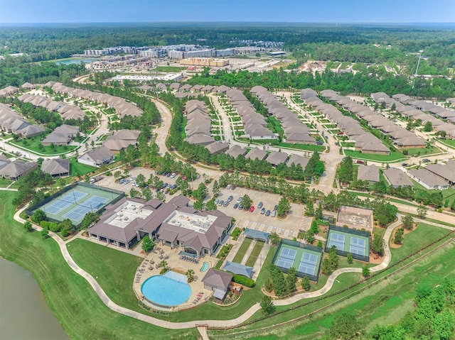 bird's eye view featuring a water view, a view of trees, and a residential view