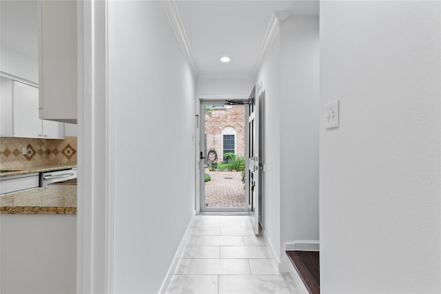 corridor with recessed lighting, baseboards, and ornamental molding