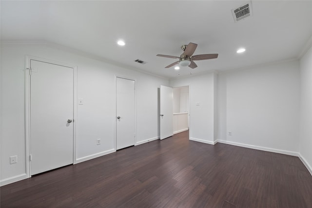 unfurnished bedroom with visible vents, recessed lighting, and dark wood finished floors