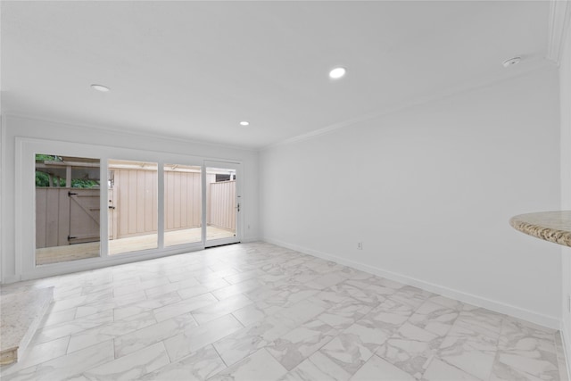 empty room featuring recessed lighting, ornamental molding, marble finish floor, and baseboards