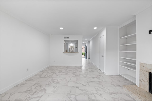unfurnished living room featuring a fireplace, baseboards, marble finish floor, ornamental molding, and recessed lighting
