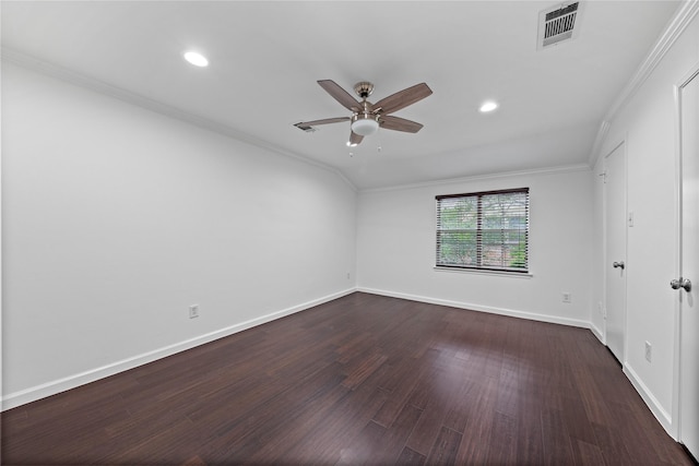 spare room featuring ornamental molding, a ceiling fan, baseboards, visible vents, and dark wood-style floors