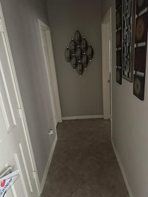 15827 Maple Shores Dr, Houston, TX 77044 - hall with a chandelier, tile patterned flooring, and baseboards
