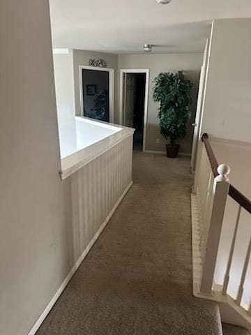 15827 Maple Shores Dr, Houston, TX 77044 - hallway featuring carpet, baseboards, and an upstairs landing