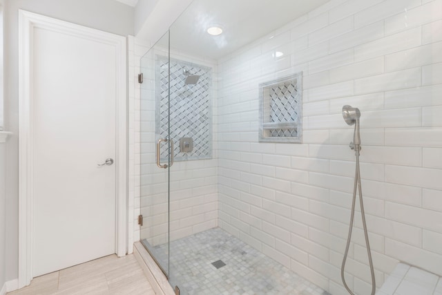 bathroom with a shower stall