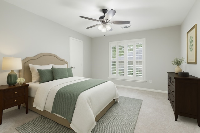 bedroom with light colored carpet, baseboards, and ceiling fan