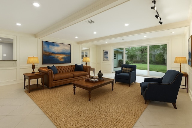 living area featuring a decorative wall, light tile patterned floors, recessed lighting, and ornamental molding