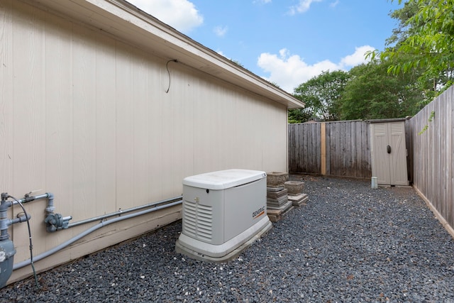 view of side of home featuring a fenced backyard